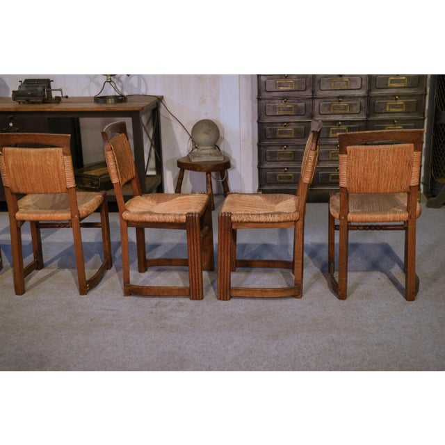 Oak and Rush Chairs in the style of Charles Dudouyt, 1950s, Set of 5, in Good conditions. Designed 1950 to 1959 This piece...