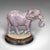 This is a delightful antique elephant doorstop. An English, handpainted cast iron decorative door keeper or mantel...
