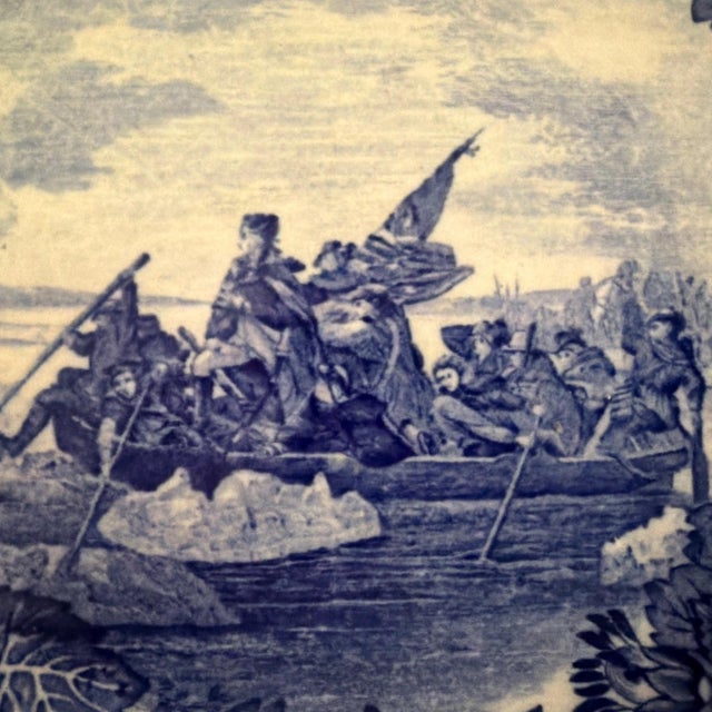 The Wedgwood Historical Blue 9" Plate featuring Washington Crossing the Delaware is a vintage collector's plate...
