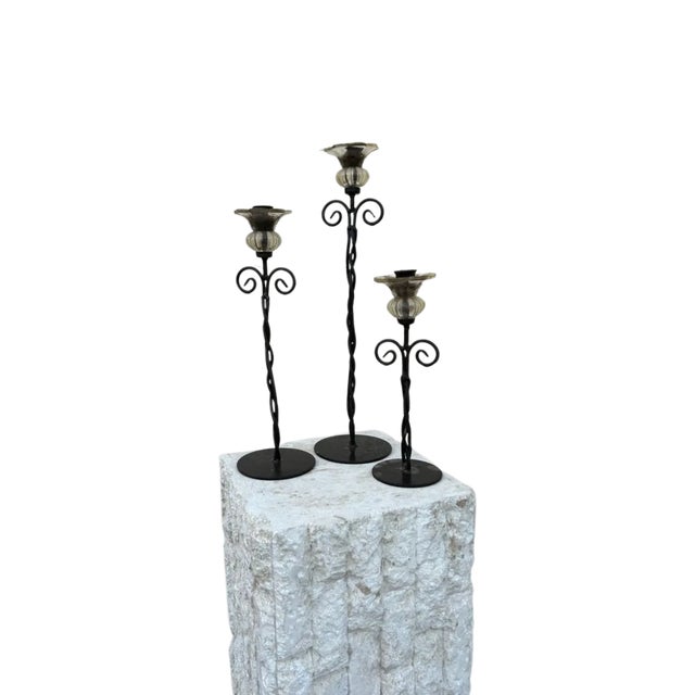 Rustic with a touch of beauty with the Glass flower that surround the candles.