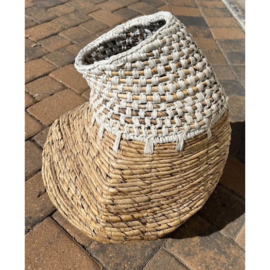 Large contemporary handwoven basket crafted from rigid natural and white seagrass. The sculptural tapered form and...