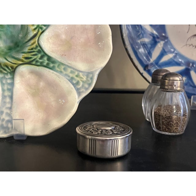Small round silver plated trinket, gift or pill box also known as a bonbinniere, made by Christofle The lid is decorated...