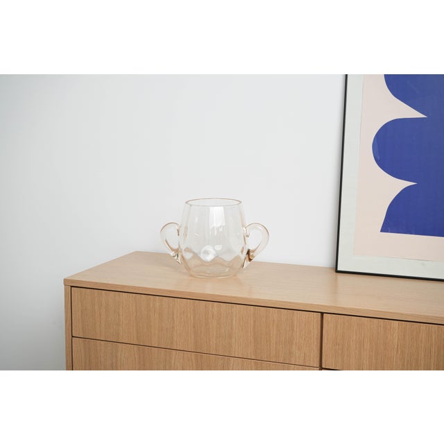 The ice bucket was made in the 1970s in Italy. An impressive, hand-blown ice bucket made of transparent glass in a...