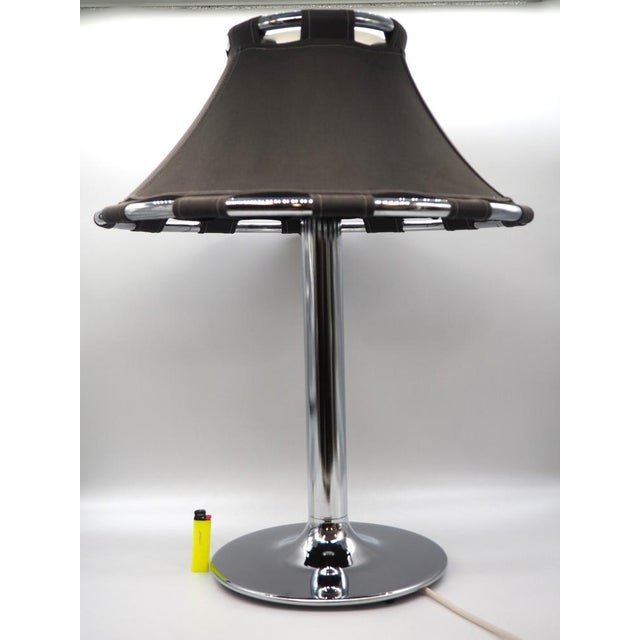 This is a design classic table lamp by Anna Ehrner. It is made of brown canvas on a chromed metal frame. The "Anna" is the...