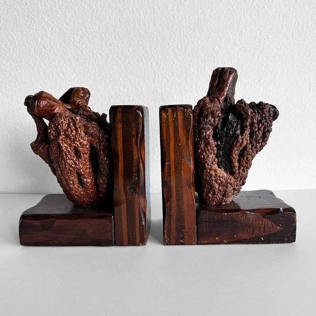 Here you have a stunning pair of early to mid-20th century burl wood bookends that are more than just functional decor,...