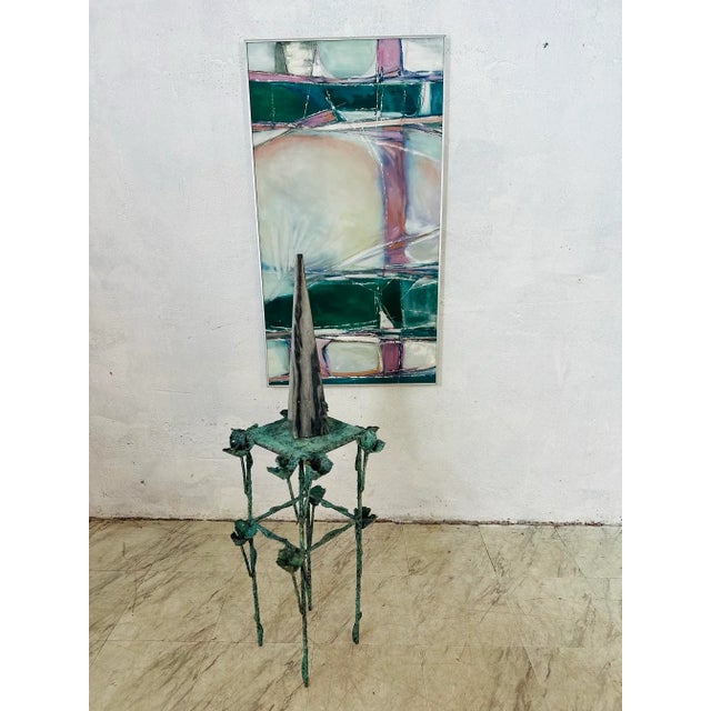 This painting is an abstract composition with soft, overlapping geometric shapes and a harmonious palette of greens,...