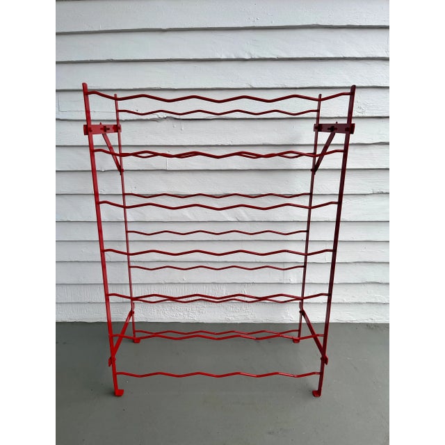 Add a touch of mid-century French industrial charm to your home with a vintage red metal wine rack by Blot Galland, made...