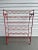 Add a touch of mid-century French industrial charm to your home with a vintage red metal wine rack by Blot Galland, made...