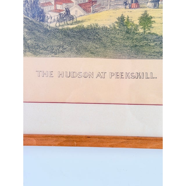 A charming antique hand-colored lithograph titled "The Hudson at Peekskill," signed in the plate Currier & Ives. Idyllic...