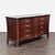 This classic wooden dresser features a unique curved front design and eight spacious drawers, perfect for organizing...
