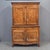 A gorgeous and functional antique late 1700s or early 1800s French elm buffet deux corps (two piece) cabinet. The old wood...