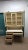 This is a wonderful yellow and white Thomasville desk with a chicken wire hutch. The top has finials and palm leaf metal...