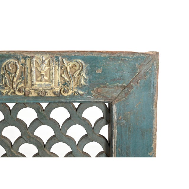 Antique Indian Painted Teakwood Window, in old blue paint, interlacing scalloped jali, and a carved yellow/gold cartouche...