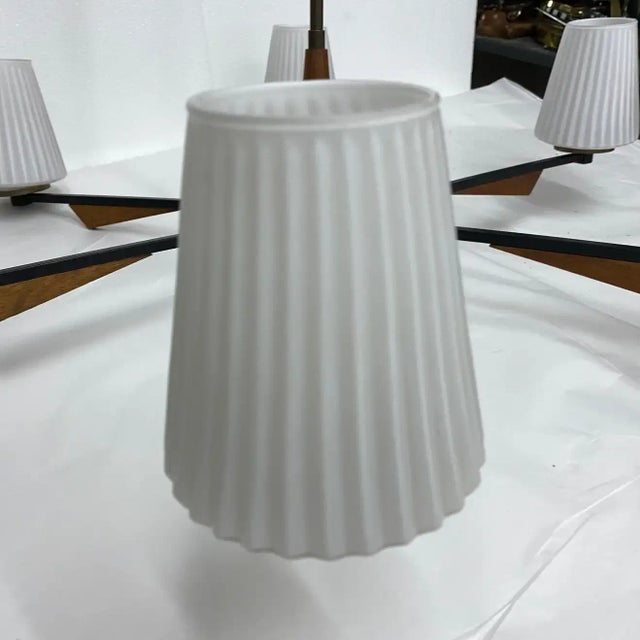 It's a teak, brass and glass six lights chandelier made in Italy in the Sixties, it has been checked and rewired by an...