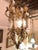 Gilt metal etched glass hanging lantern. This Mid-Century Modern lantern is finely decorated with a gilt metal scroll and...