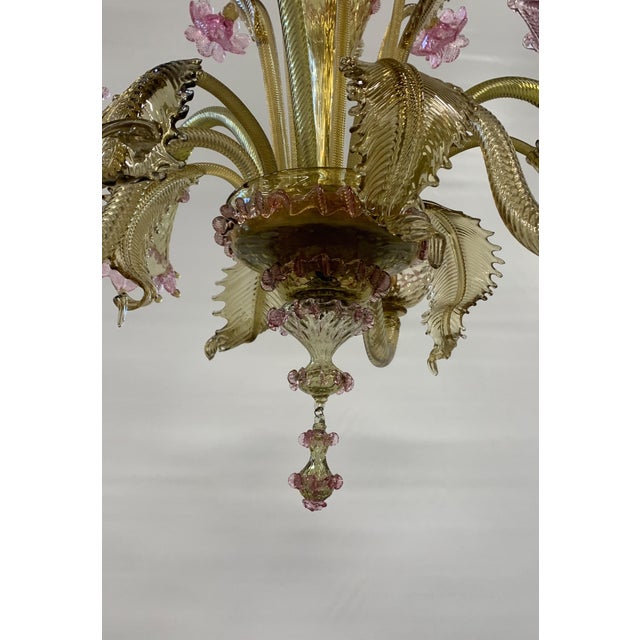 A six-light chandelier attributed to cesare toso, crafted from hand-blown murano glass, featuring a refined floral motif...