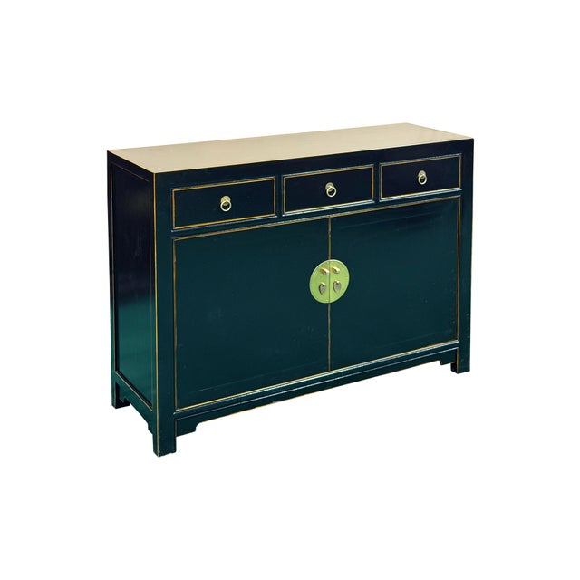 Elevate your living space with this striking accent cabinet, expertly finished in a sophisticated black lacquer...