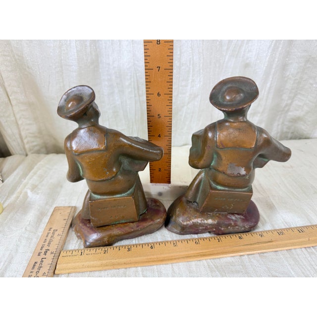 American 1920s Hubley Cast Iron Accordion Player Bookends on Banded Onyx - Pair For Sale - Image 3 of 11