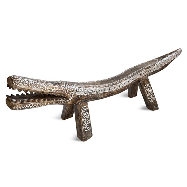 Impressive large-scale hand-carved crocodile bench from Indonesia, sculpted from a single solid log and richly detailed...
