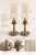 A charming pair of vintage etched-glass hurricane lamps distinguished by their petite proportions, romantic botanical...