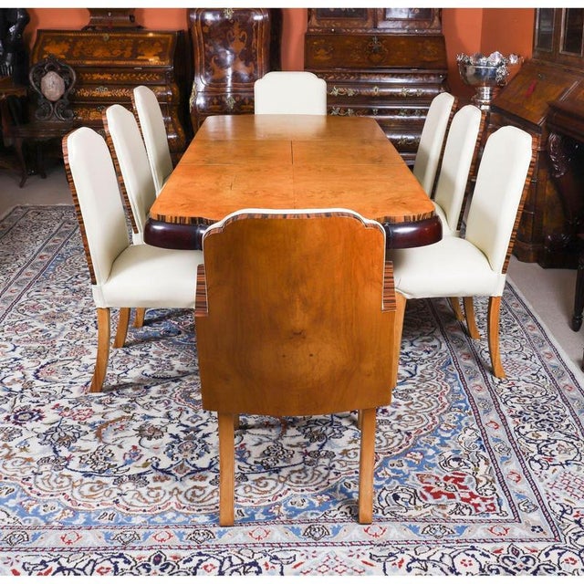 A truly stunning antique Art Deco burr walnut and Coromandel dining suite attributed to the world-renowned cabinet makers...