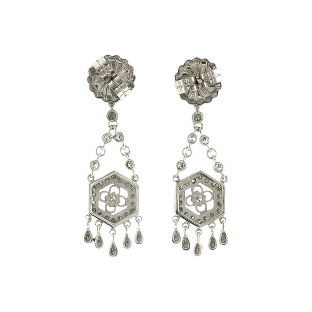 Elegant late 20th-century drop earrings crafted in 14k gold. Featuring 74 brilliant-cut white diamonds with a total carat...