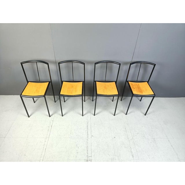 Postmodern dining chairs designed by Sergio Calatroni and Maurizio Peregalli in 1985 and produced by Zeus Noto Fine black...