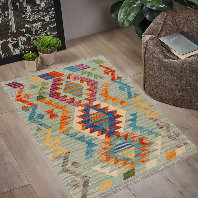Elevate the elegance of your home with this stunning hand-woven tribal Kilim wool rug. Meticulously crafted on a loom by...