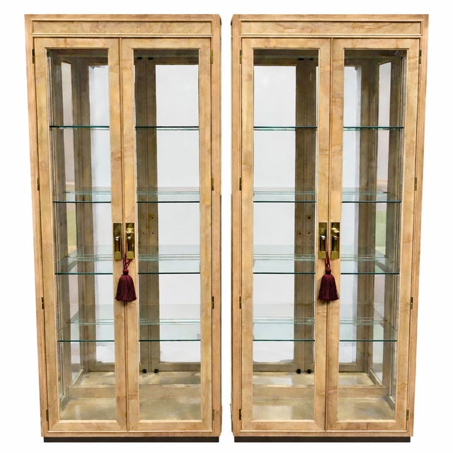 This Pair of vintage Drexel Heritage in Olive Burl Wood and Glass Display Cabinets is elegant with a material richness...