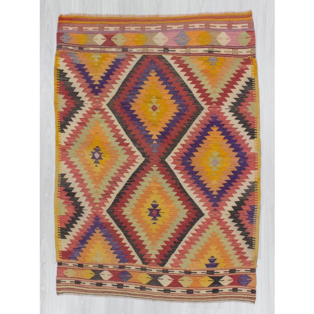 Handwoven small colorful kilim rug from Denizli region of Turkey. In good condition. Approximately 45-55 years old.