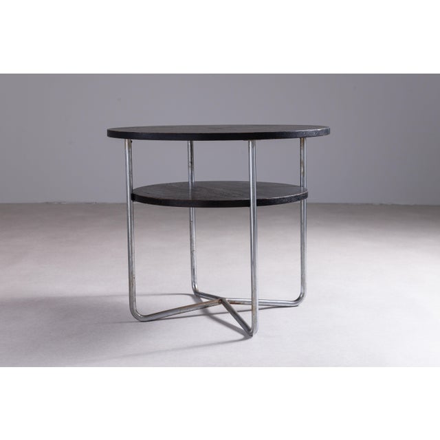 This round Thonet coffee table is a refined example of timeless modern design, balancing elegance with practicality. Its...