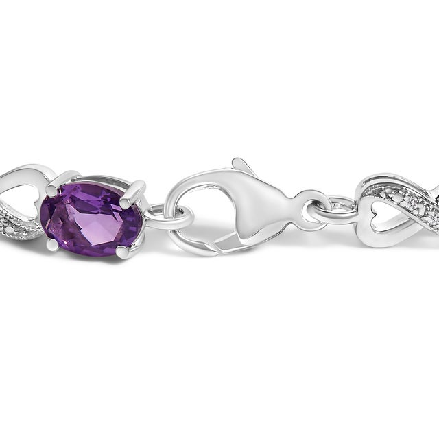 Immerse yourself in the elegance of our enchanting bracelet, exquisitely crafted from rhodium-plated .925 sterling silver...