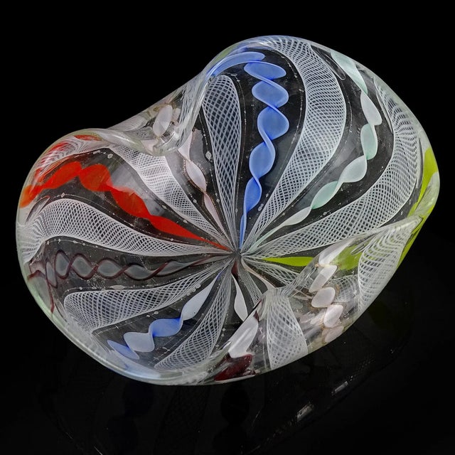 Beautiful vintage Murano hand blown rainbow colors and white ribbons Italian art glass decorative bowl, dish. Created in...