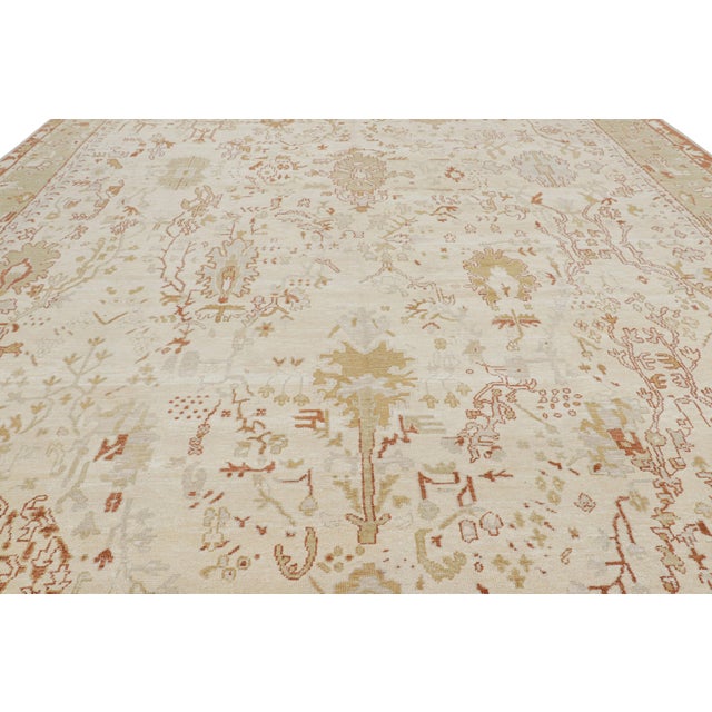 Made with hand-knotted wool and silk, this 12x16 contemporary rug is a bold reimagining of vintage and antique Oushak rugs...