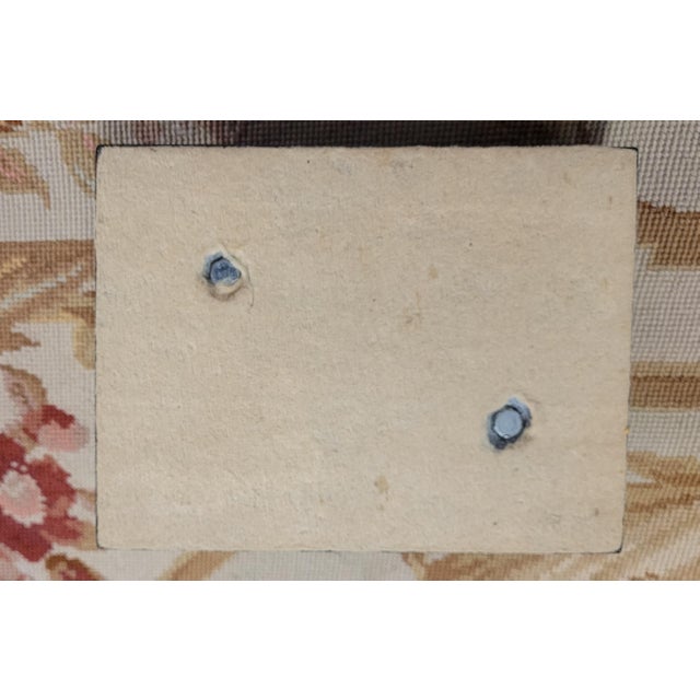 Fine vintage bronze sculpture of an English Springer Spaniel resting on a tassel pillow. Made of solid bronze and mounted...