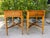 A charming pair of vintage pine side tables by Robb & Stucky featuring beautifully shaped scalloped tops, warm honey-toned...