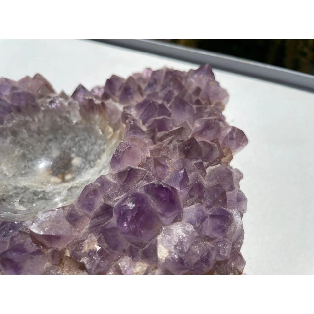 This item is a special one by the shape witch is well balanced, and the shine of the stone. This an Amethyst astray or...