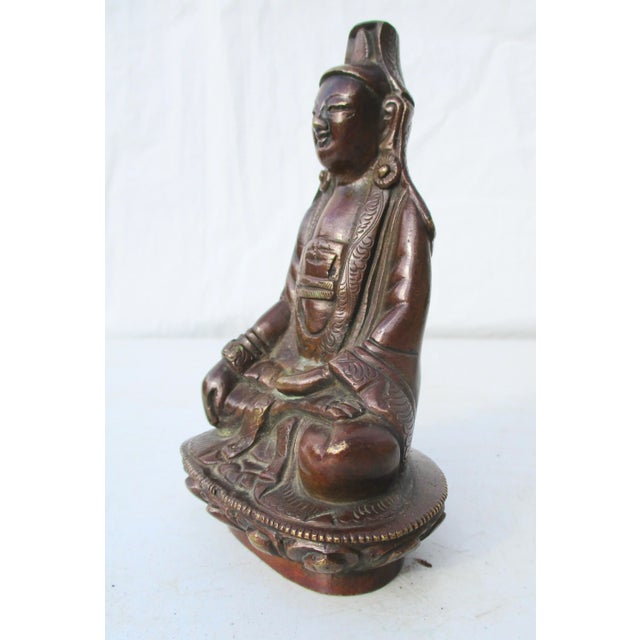 Bronze Kuan Yin Bronze from China vintage 1910s'. Beautifully carved bronze os seated Kuan Yin in dark bronze material....