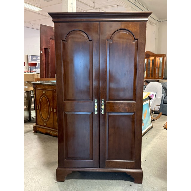Design Plus Gallery presents a Cherry Television Armoire from Stickley Furniture. This tall cabinet displays classic...
