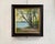 This oil painting captures a tranquil riverside scene bathed in soft, golden light, evoking a sense of peace and serenity....