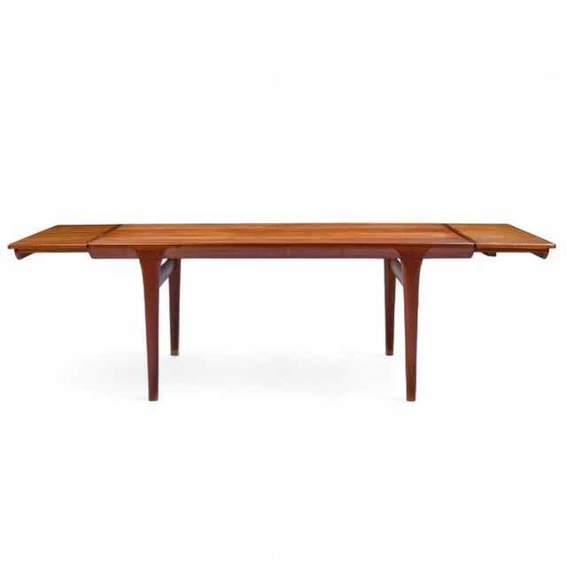 Kofod Larsen for Faarup Møbelfabrik Mid Century Teak Hidden Leaf Expanding Dining Table This table measures: 68 wide x...