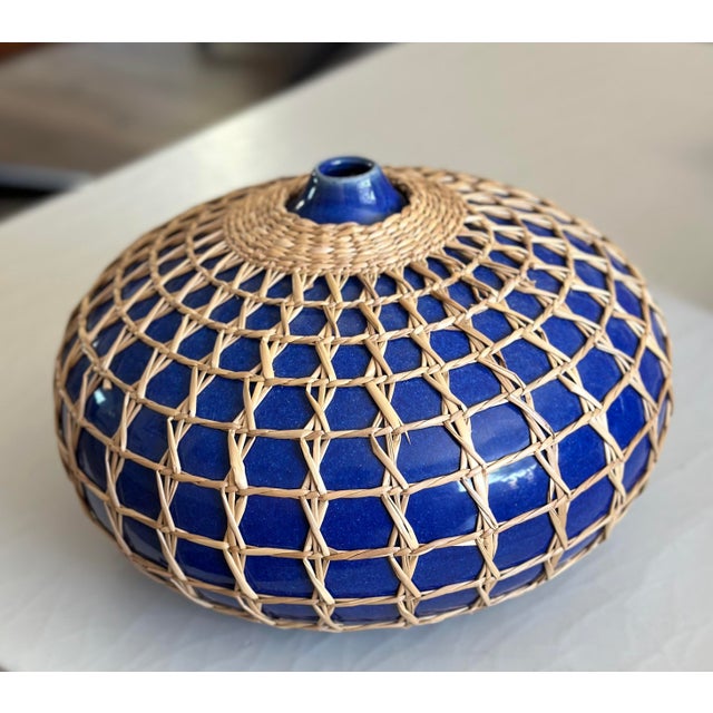 Handwrapped in seagrass, this 12" x 9"hand-thrown ceramic vessel adds a touch of coastal charm. Unique and finely crafted,...
