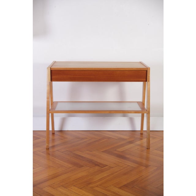 Will be great as a night table. Good size, airy and light in weight and color. Ash wood and veneered top, drawer has...