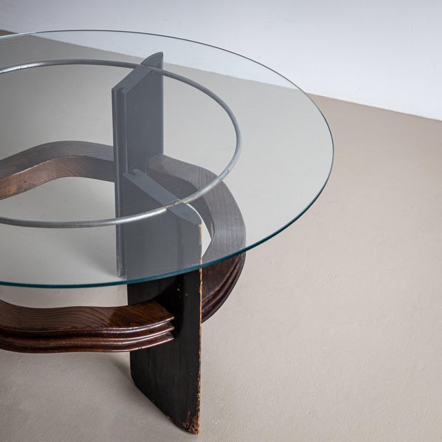 This iconic round coffee table attributed to Italian designer Vittorio Valabrega from the 1930s features an elegant glass...