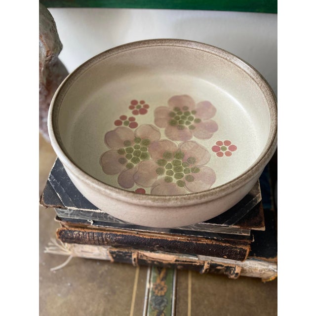 Lovely English stoneware serving bowl by Denby, presented in a soft taupe Glaze, with large blooms across the center of...
