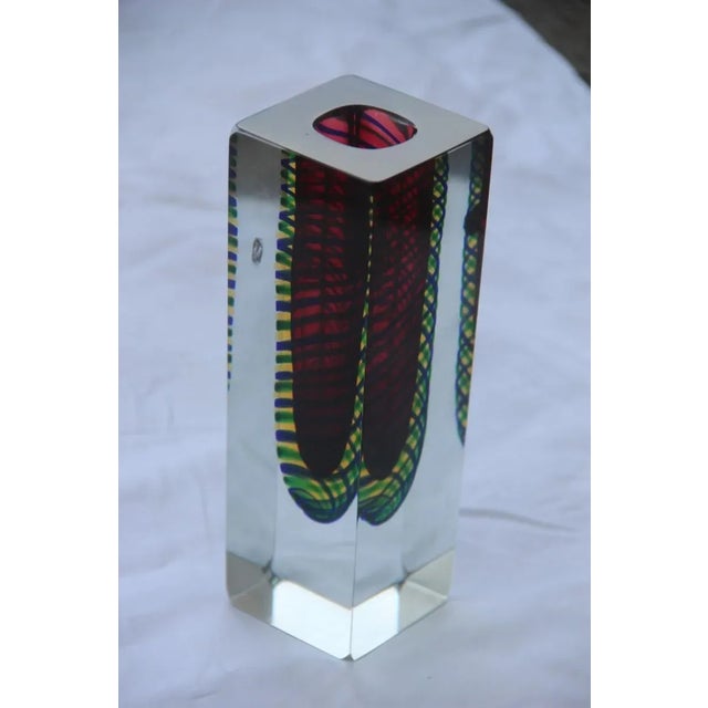 This small square solid Murano glass vase features an interior in green yellow red colors.