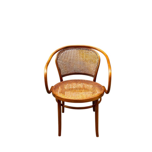 French chair in the Michael Thonet style, circa 1960, made of bent beech wood with rattan caning on the seat and back. An...