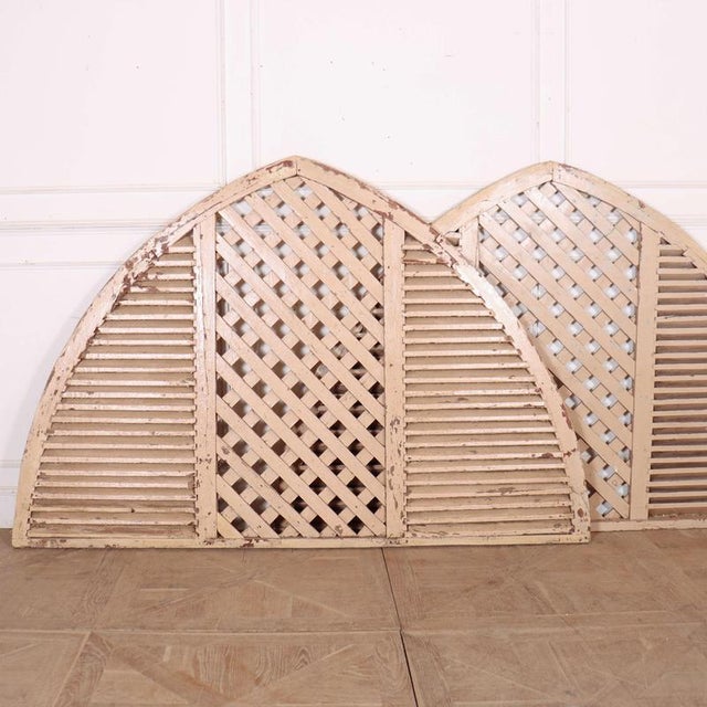 Wonderful pair of French painted pine arched shutters. These would make a great headboard for a bed. 1900 This piece is...