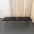 This sleek Mid-Century Modern slatted platform bench, inspired by vintage "transit" style designs, brings timeless...