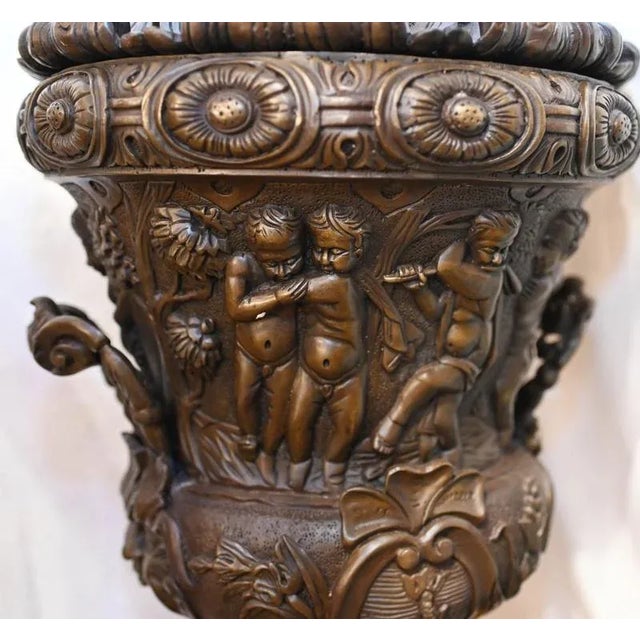 You are viewing an incredible pair of large bronze urns of campana form The urns are lidded and stand in at three feet...